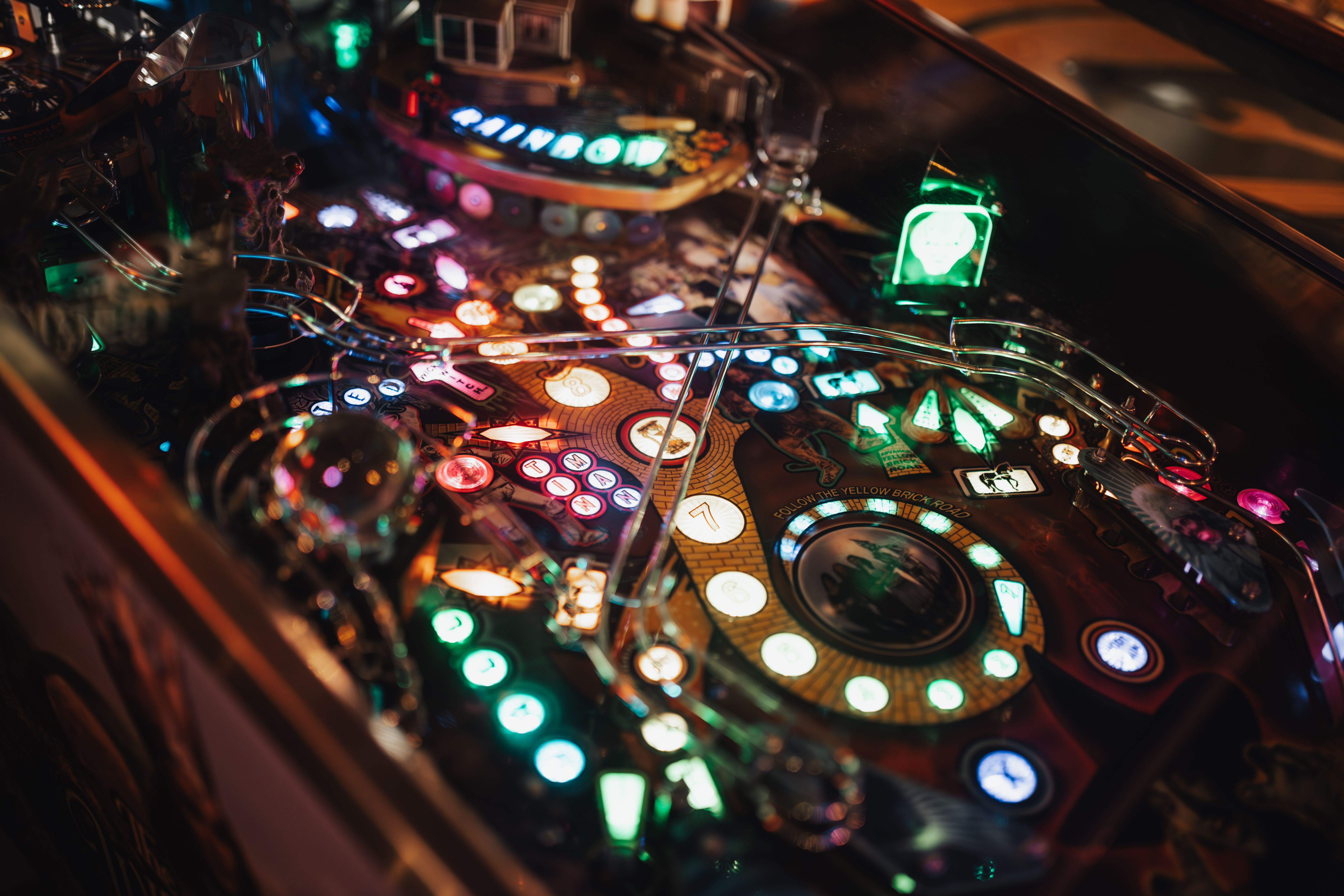 Close-up of an illuminated pinball machine playfield